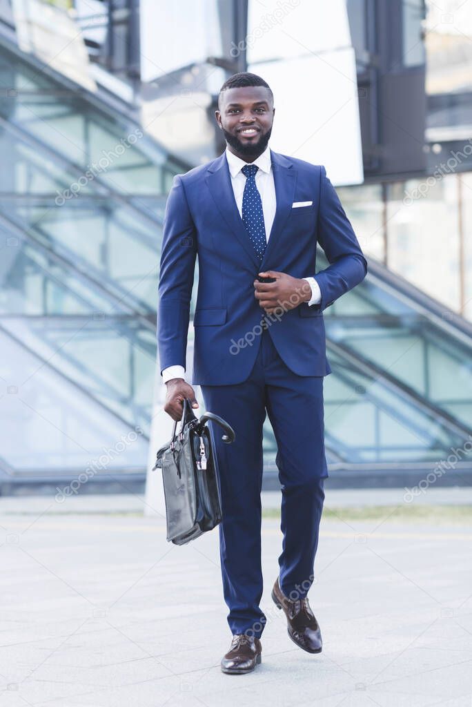 Successful African Businessman Going On Business Meeting In City, Vertical