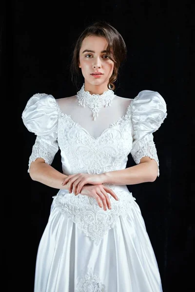 Woman in vintage wedding dress