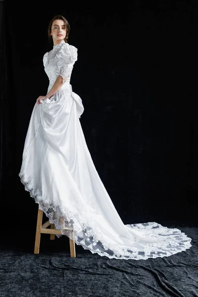 Woman in vintage wedding dress