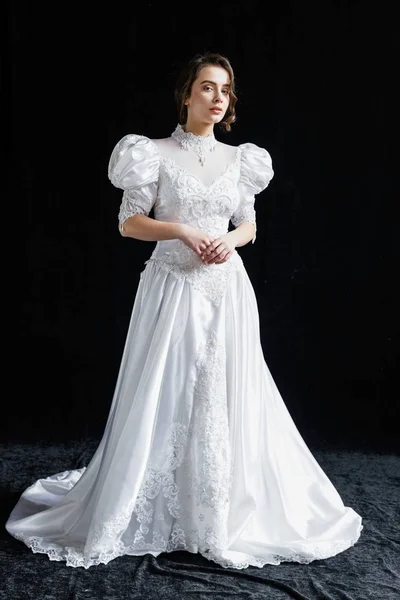 Woman in vintage wedding dress
