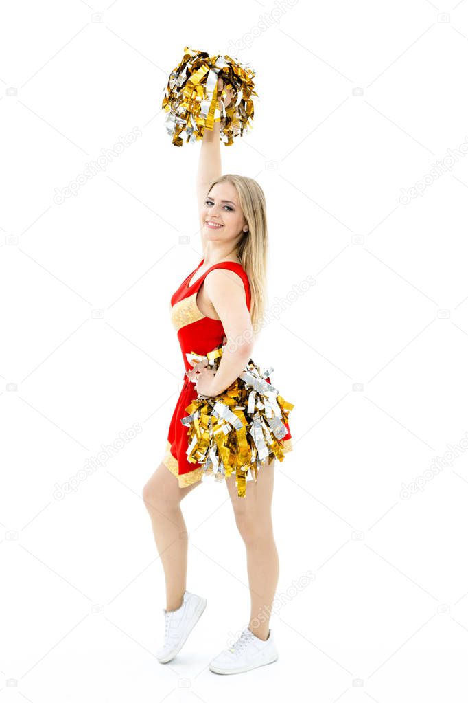 Cheerleader posing with pom-poms