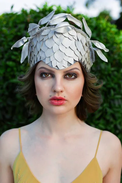 Woman in elegant headwear — Stock Photo, Image