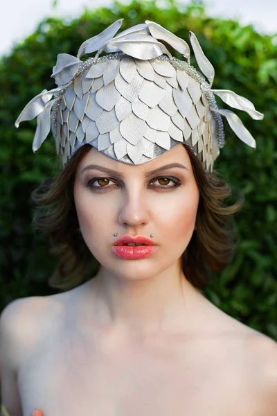 Woman in elegant headwear — Stock Photo, Image