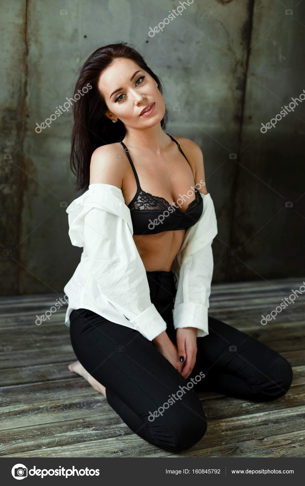 Woman in black bra and white shirt Stock Photo by ©smmartynenko