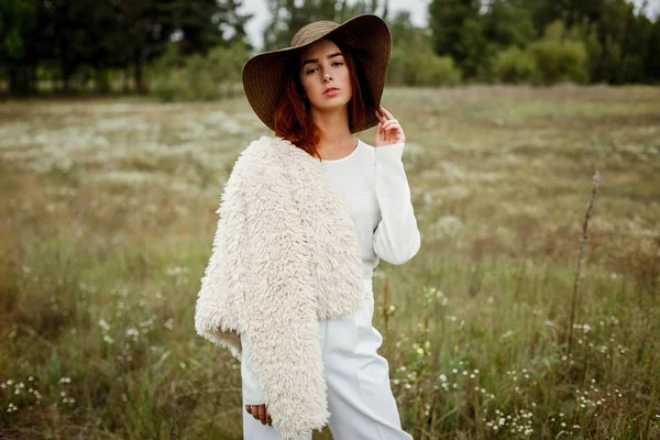 Stylish young woman in hat — Stock Photo, Image