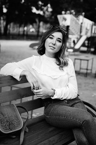 woman sitting on bench