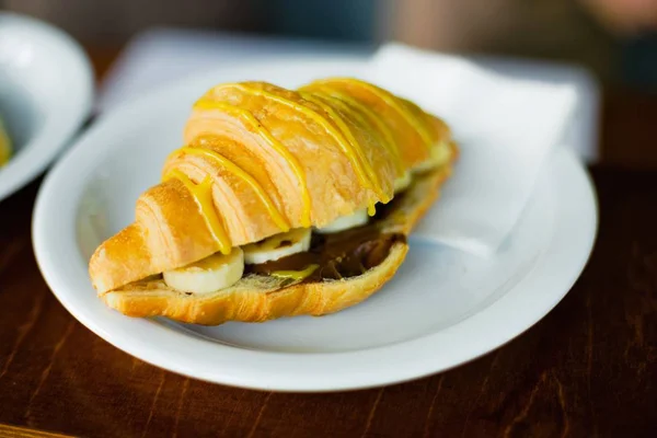 French croissant with banana — Stock Photo, Image