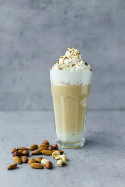 Latte macchiato coffee with nuts — Stok Foto