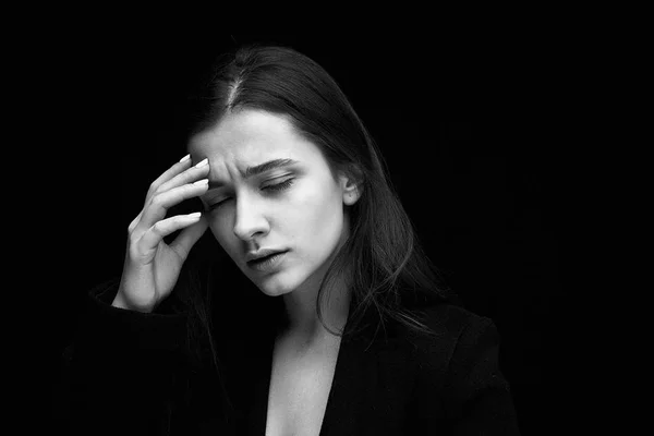 Portrait of gorgeous fashion model against dark studio background