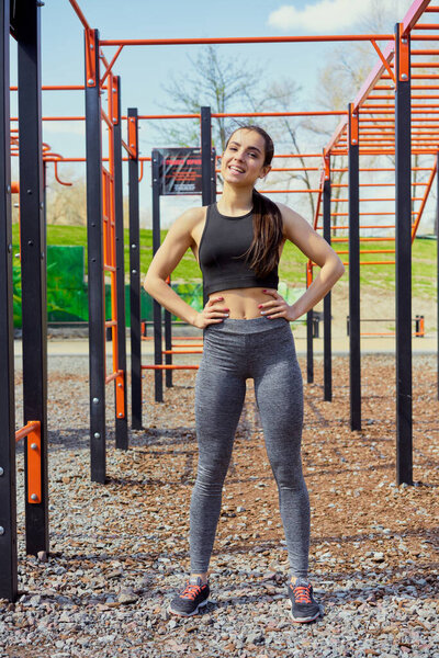 young woman doing exercises outdoor