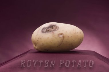 Rotten potato on read clipart