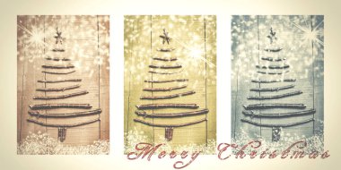 Merry Christmas karlı triptych kahverengi, yeşil ve mavi yazılı kelime. Ahşap dallarında yapılan Noel ağaçları.