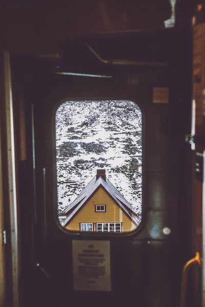 Beautiful mountain house in the window train — Zdjęcie stockowe