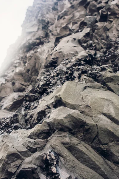 Black lava stones on seashore — Stock Photo, Image