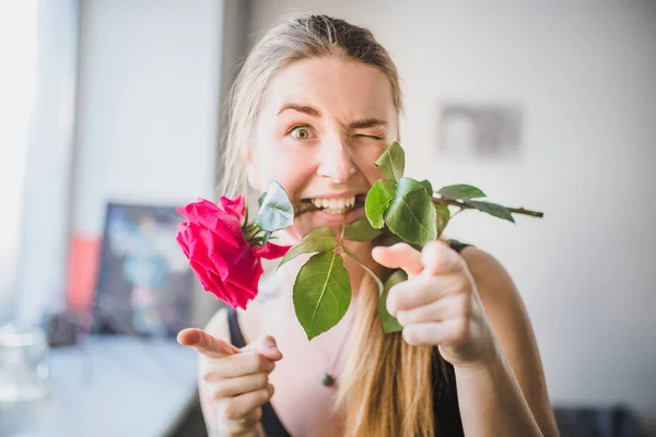 Woman with pink rose — Stock Photo, Image