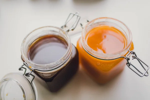 Sweet honey in glass jars — Stock Photo, Image