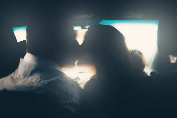 lovely couple kissing in car