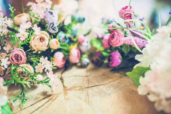 close-up of beautiful bouquet of spring flowers on wooden background 