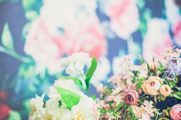 close-up of beautiful bouquet of colored flowers on background  