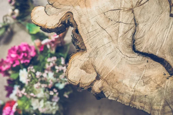 Close Wooden Table Blurred Colored Flowers Background — Stock Photo, Image