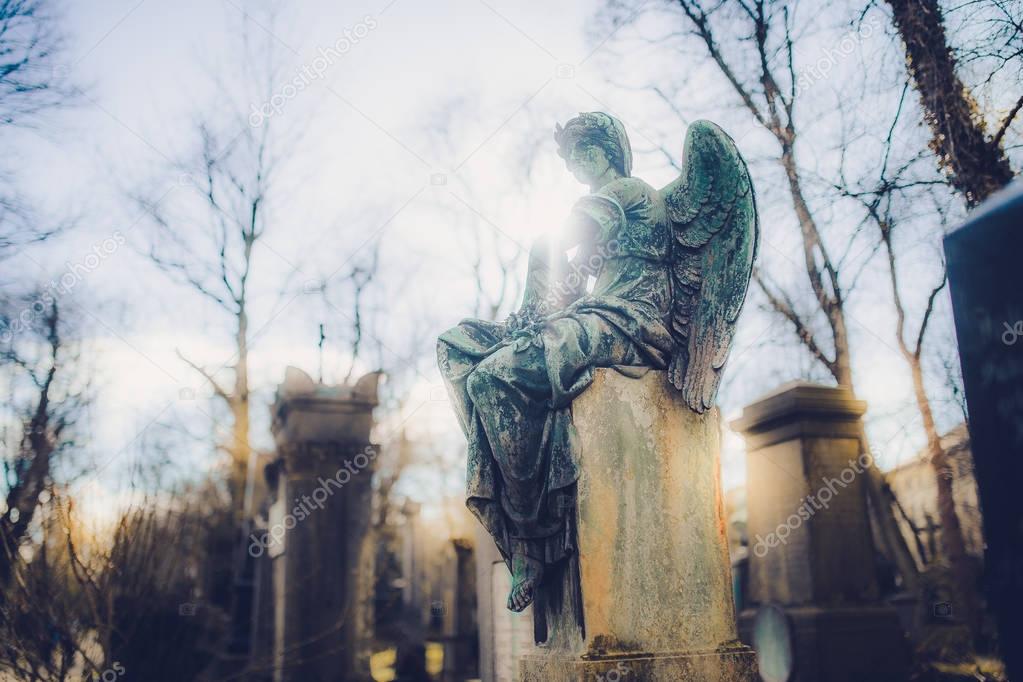 close-up of old Angel monument at Munich cemetery in Germany 