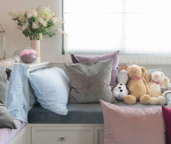 kid's bedroom with dolls and set of pillows
