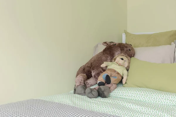 Kid's bedroom with green color tone and dolls — Stock Photo, Image