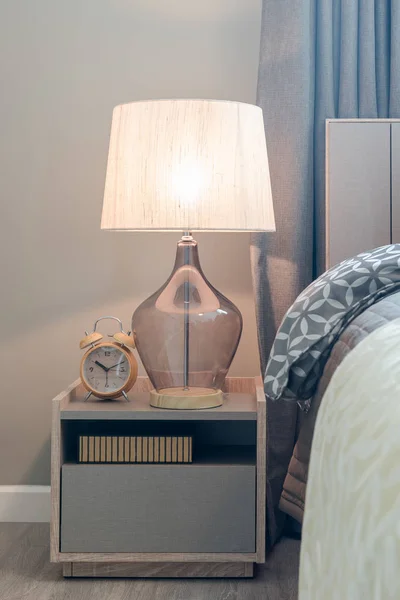 Classic lamp style with alarm clock on table side in cozy bedroo — Stock Photo, Image