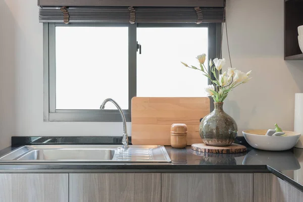 modern kitchen room with black granite on top of counter