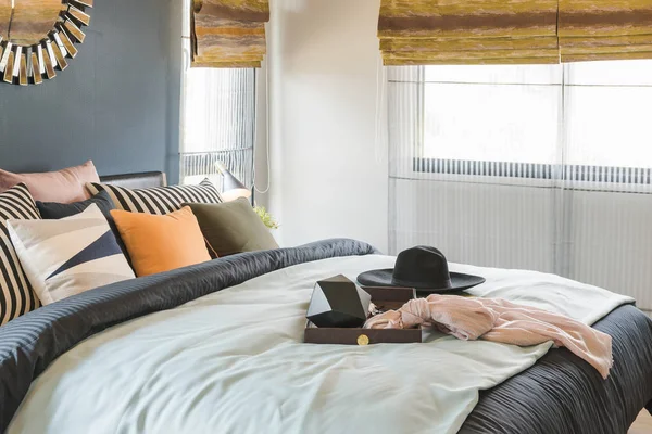 Set of pillows on bed with blanket — Stock Photo, Image