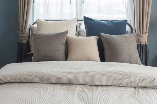 Set of pillows on bed in modern bedroom style — Stock Photo, Image