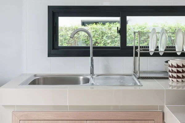 Modern kitchen room with sink on counter — Stock Photo, Image