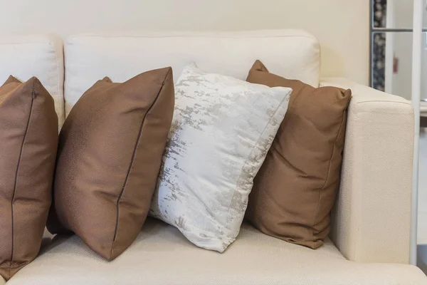 Set of pillows on white sofa in living room — Stock Photo, Image