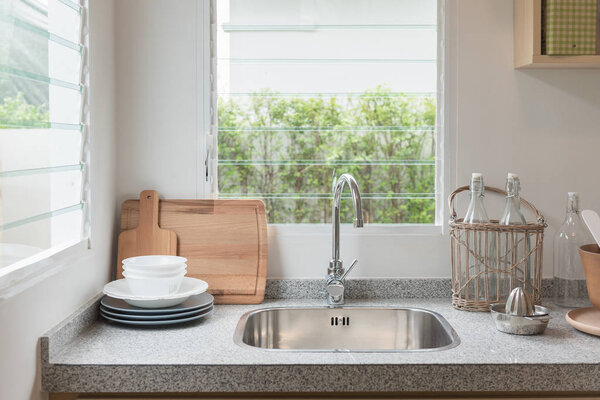 modern kitchen room with sink on counter