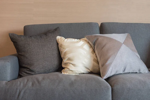 Set of pillows on dark color elegance sofa — Stock Photo, Image