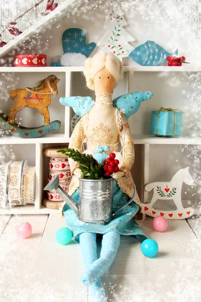 Textile doll with gifts and toys for Christmas