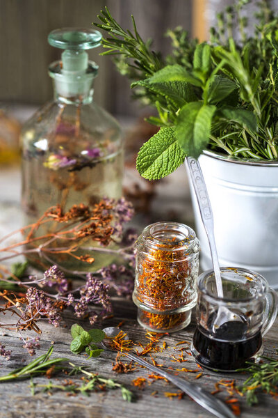 Herbs and spices flicking, thyme, rosemary on a wooden boards