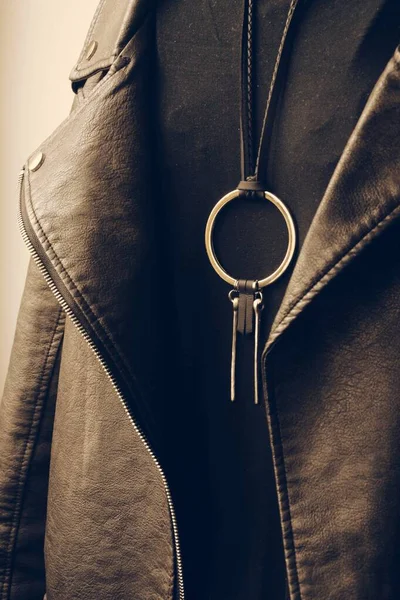 Leather jacket with metal jewelry, fashion grunge style photo