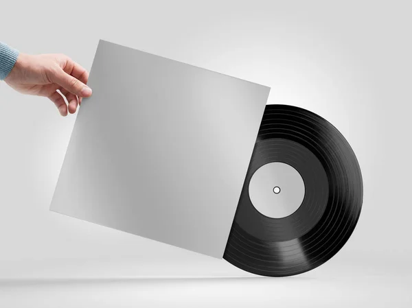 Vinyl registrera i hand mockup — Stockfoto
