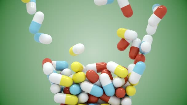Coloridas píldoras caen y luego se vierten — Vídeo de stock