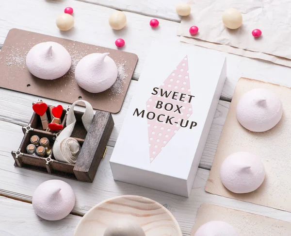 White box with different sweets on table — Stock Photo, Image
