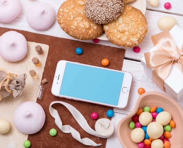 Iphone on white wooden desktop — Stock Photo, Image