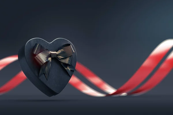 Heart shaped gift box with bow on black — Stock Photo, Image