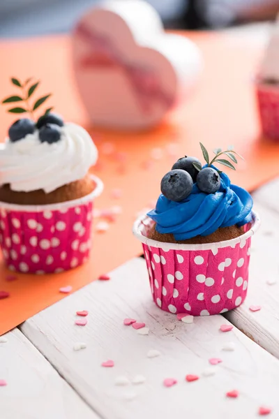 Cupcakes and heart shaped gift boxes — Stock Photo, Image