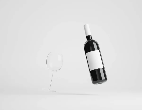 Vinflaska med vinglas över vitt — Stockfoto
