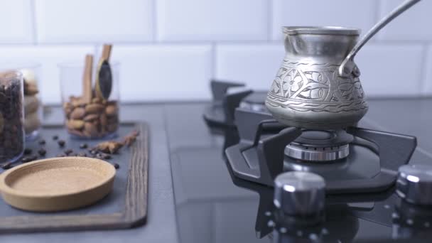 Pan shot of a coffee turk on a gas cooker — 비디오