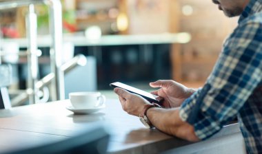 Closeup of a man with smartphone in hands.