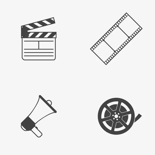 Set of movie monochrome vector icons. Film reel, strip, clapperboard and megaphone. Vector illustration. — Stock Vector