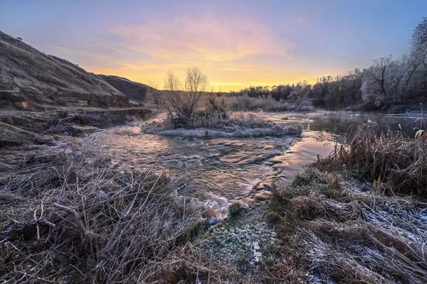 Morning frost on grass.Morning freshness in the cold.Bubbling river.Hoarfrost on the hills.Frost on the trees.Thresholds on the river.Juicy Dawn Colors.autumn frost.Ice on the river.Morning awakening.Walk on a frosty morning in nature.nature.