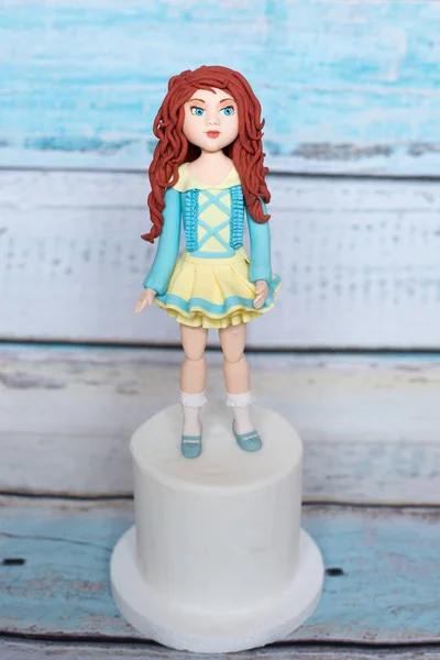 Marzipan handmade doll for cake decoration